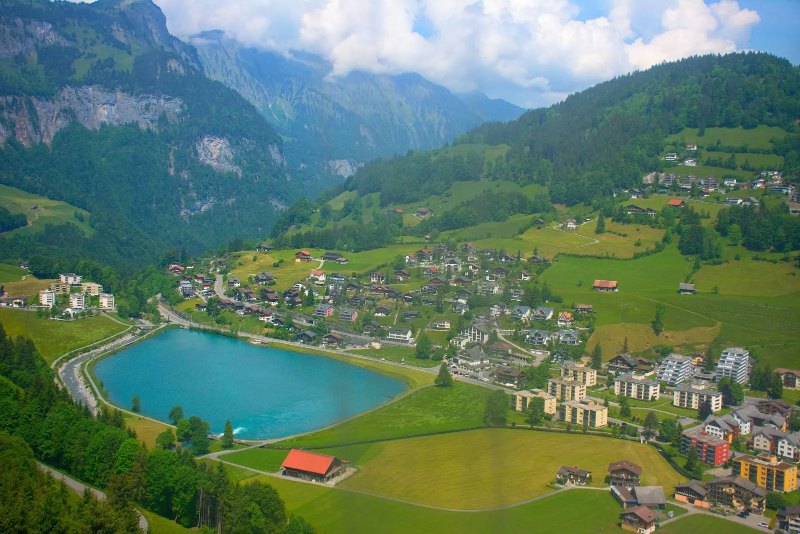 Alpine village nestled beside a clear blue lake: Europe (multi-country) holiday packages by OYG Holidays