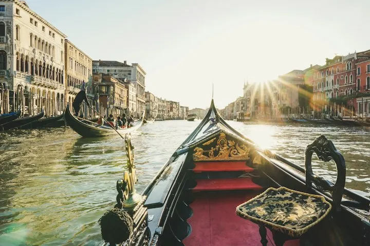 Black boat on water Gondola ride, Venice: Italy holiday packages by OYG Holidays