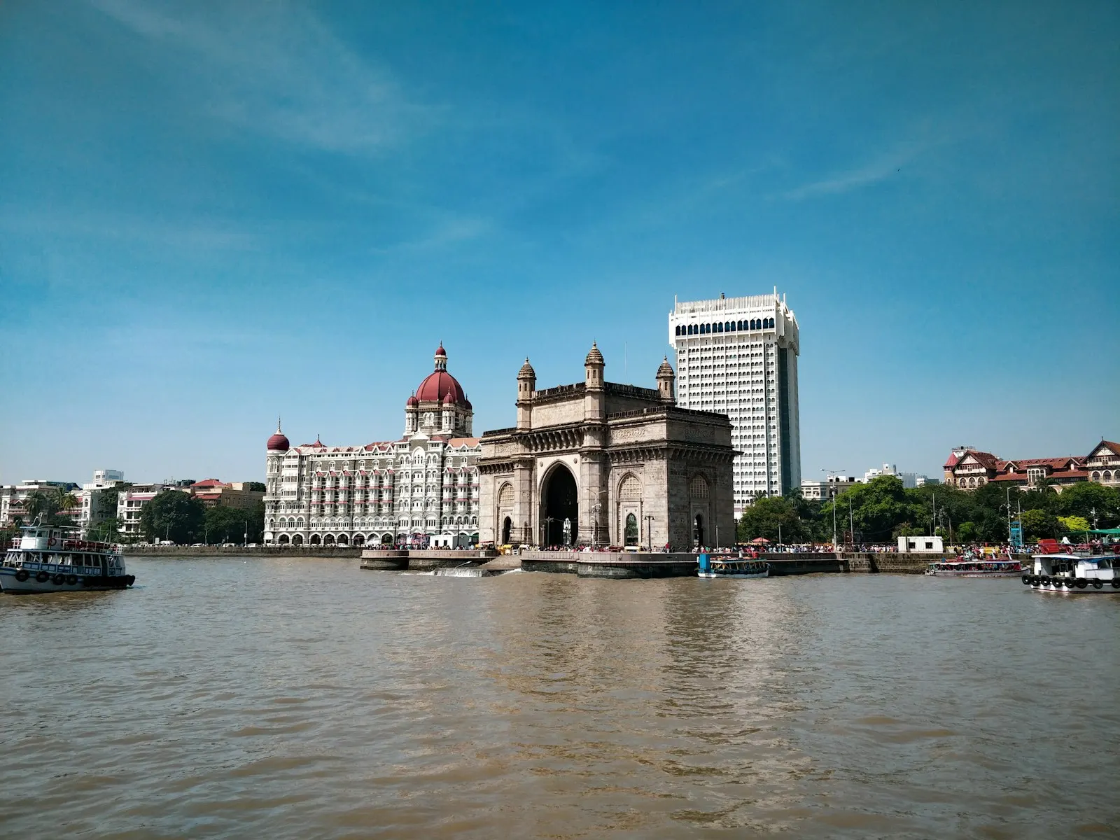 The Gateway of India and Taj Mahal Palace hotel on the Mumbai waterfront View of the Gateway of India from the sea: Maharashtra holiday packages by OYG Holidays
