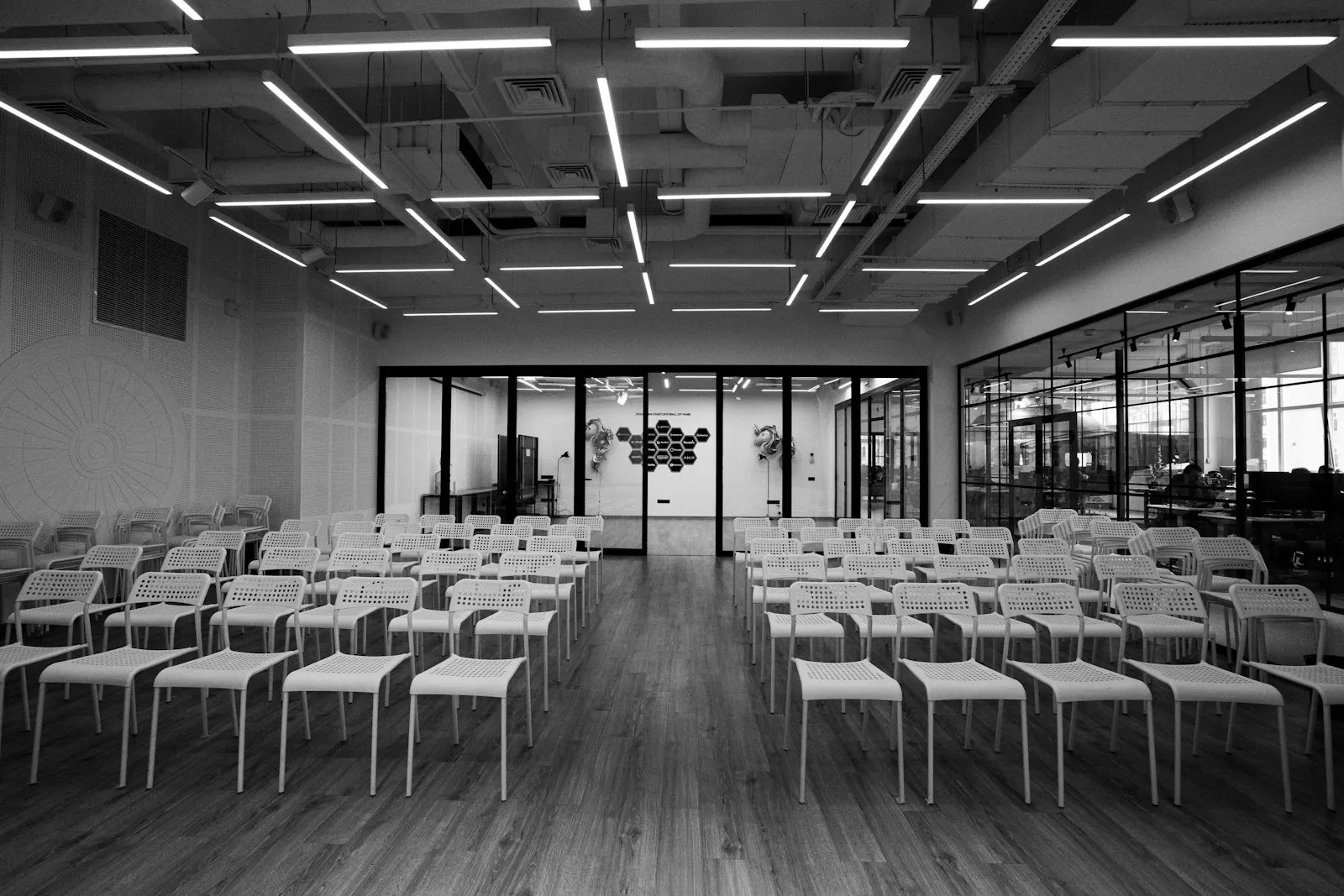 Grayscale photo of empty chairs Black & White: MICE and corporate travel by OYG Holidays